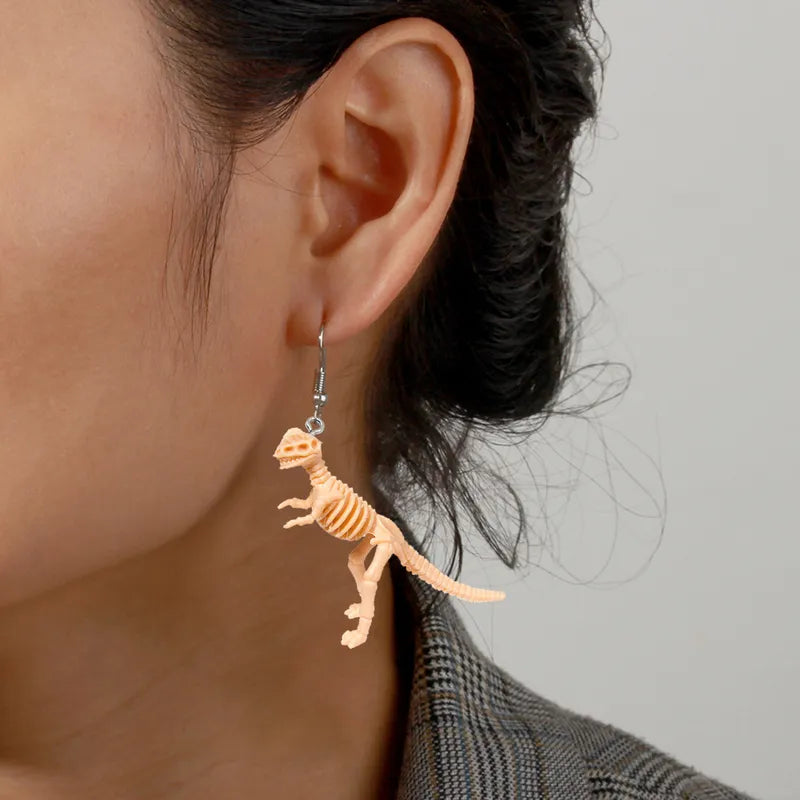 Par de aretes dinosaurios