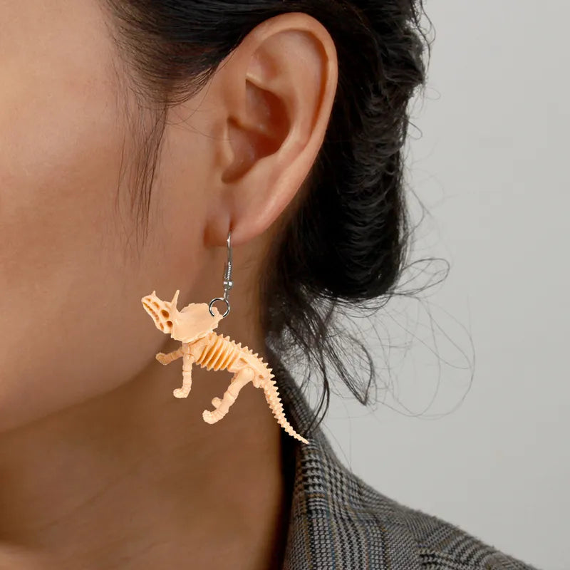Par de aretes dinosaurios