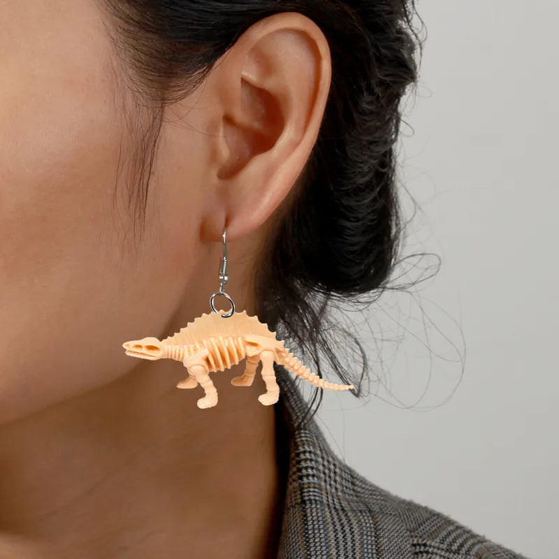 Par de aretes dinosaurios