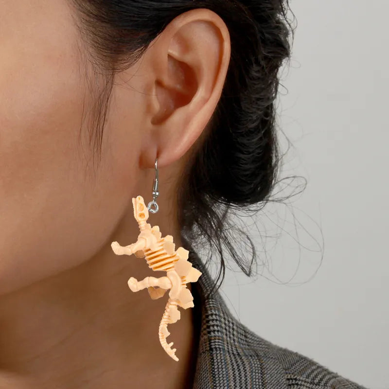 Par de aretes dinosaurios