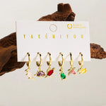 Set de 6 aretes dinosaurios baño de oro 14k