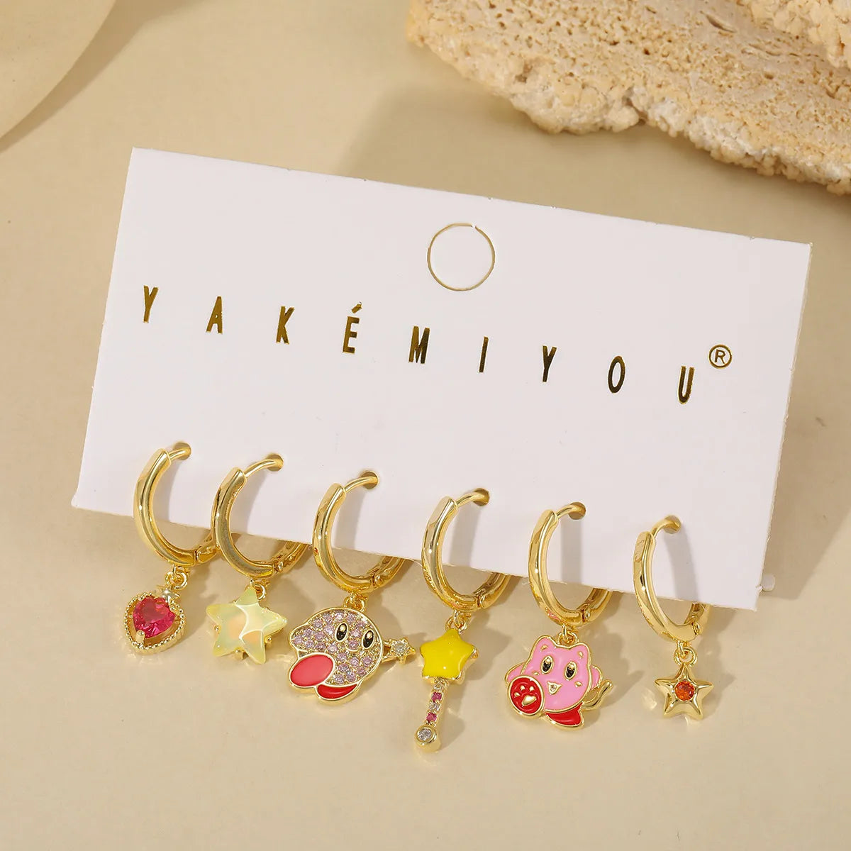 Set de 6 aretes Kirby baño de oro 14k