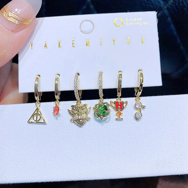 Set de 6 aretes Harry Potter baño de oro 14k