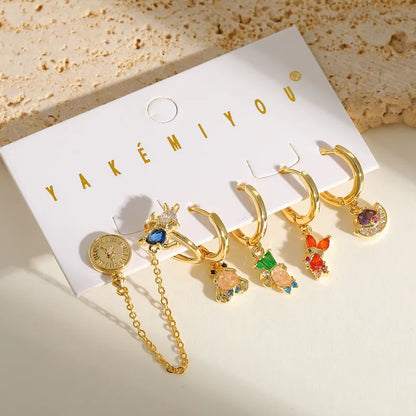 Set de 6 aretes Alicia en el País de las Maravillas baño de oro 14k