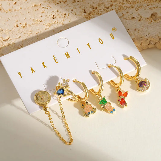 Set de 6 aretes Alicia en el País de las Maravillas baño de oro 14k