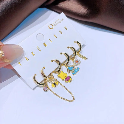 Set de 6 aretes Winnie Pooh baño de oro 14k
