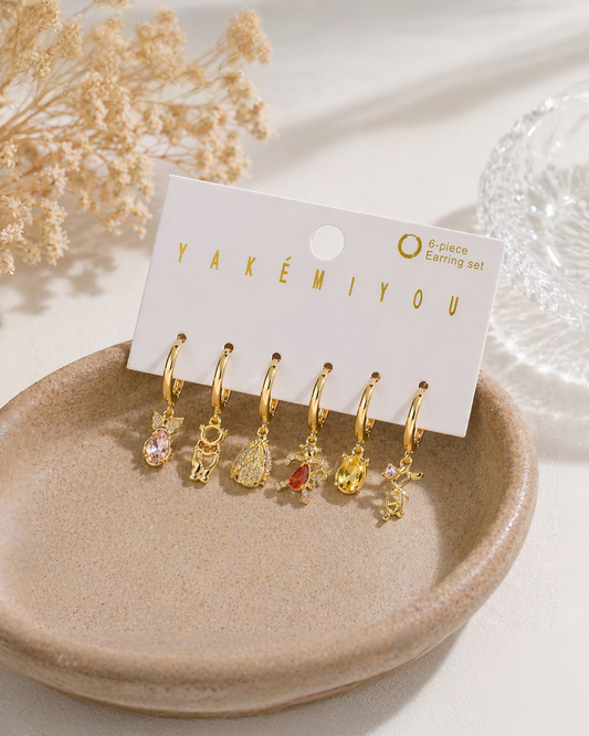 Set de 6 aretes Winnie Pooh baño de oro 14k