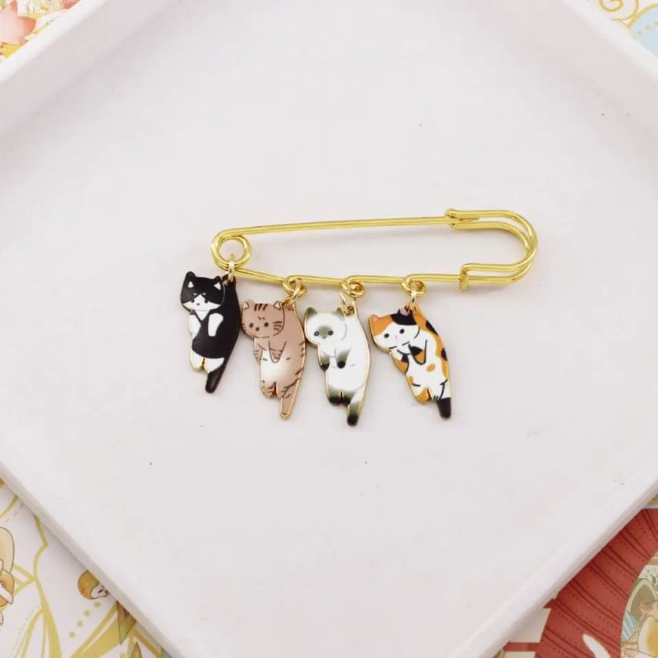 Broche de gatitos