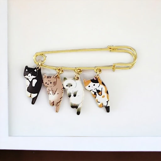 Broche de gatitos