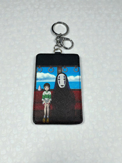 Tarjetero y llavero No Face