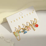 Set aretes Stitch baño de oro 14k