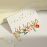 Set aretes Stitch baño de oro 14k