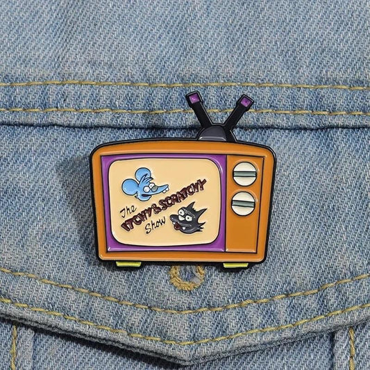 Pin Tomy y Daly