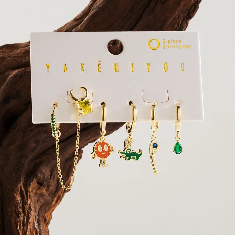 Set de 6 aretes Loki baño de oro 14k