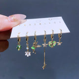 Set de 6 aretes de Campanita baño de oro 14k