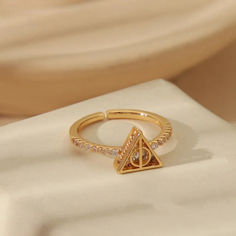 Anillo ajustable Reliquias de la Muerte baño oro 14k