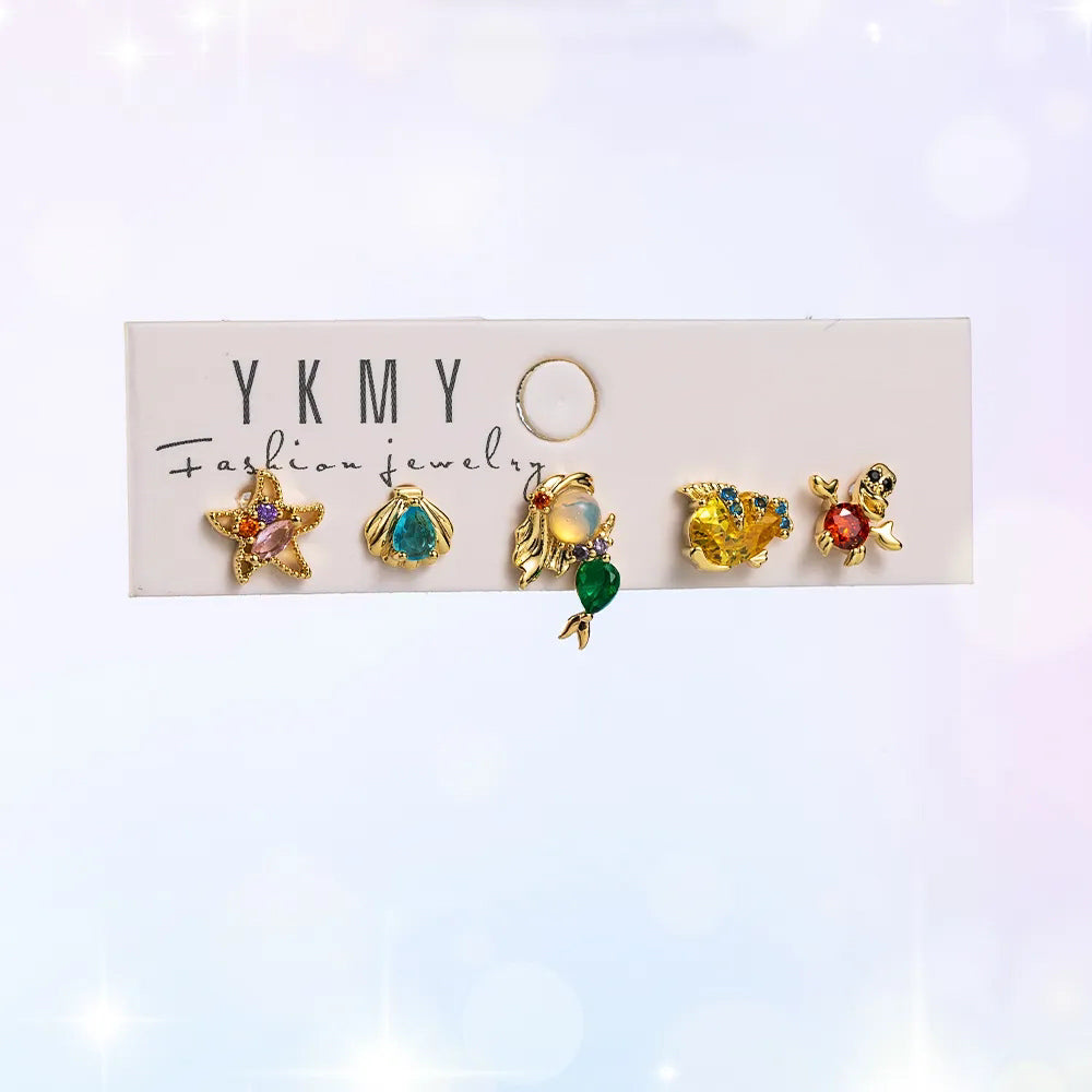 Set de 5 aretes de La Sirenita baño de oro 14k